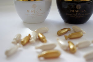 Nigella Therapy Perfecting Day and Night Serum jars and snipgels.
